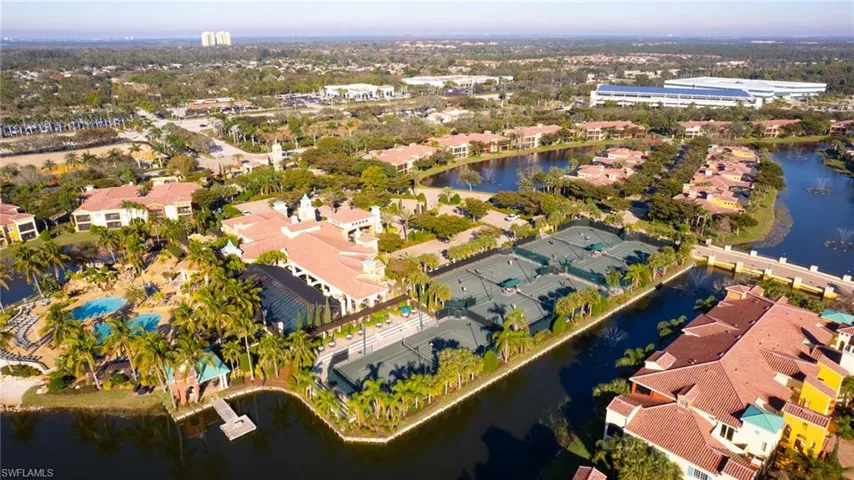 View of property location with a nearby body of water and nearby suburban area