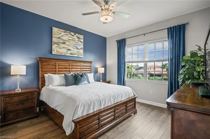 Bedroom with wood finished floors and a ceiling fan
