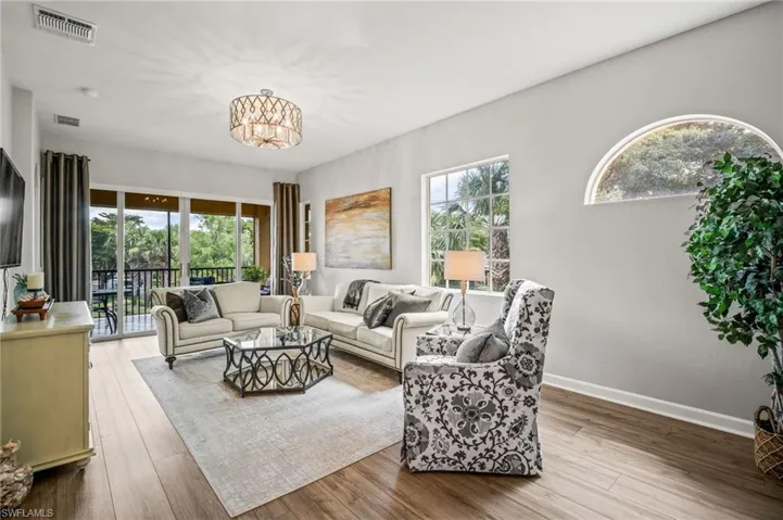 Living room with a chandelier and wood finished floors