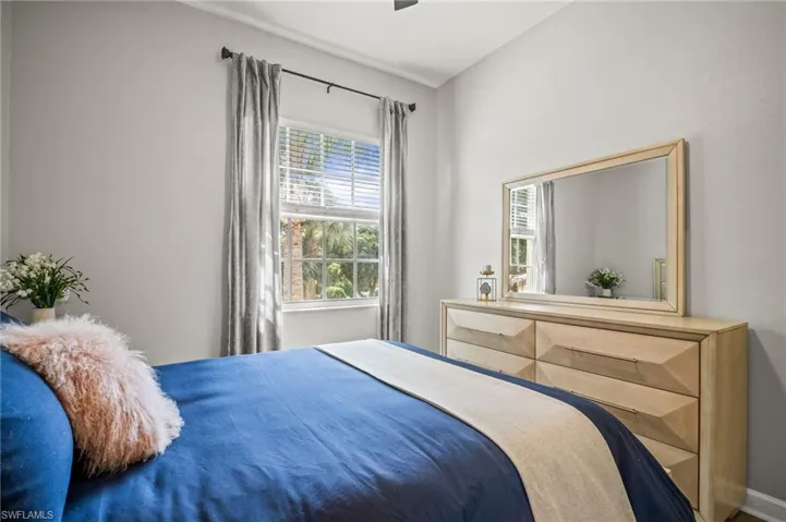 Bedroom with baseboards and ceiling fan