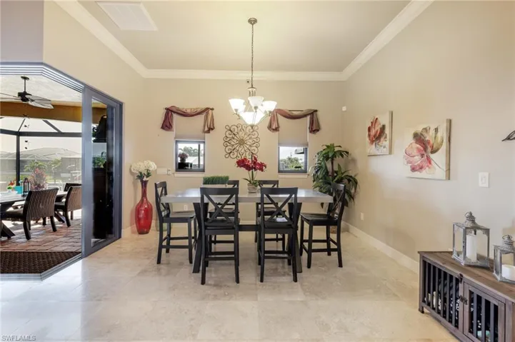 Dining room featuring crown molding and baseboards