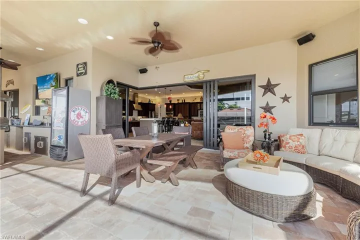 View of patio with a ceiling fan, outdoor dining space, and an outdoor living space