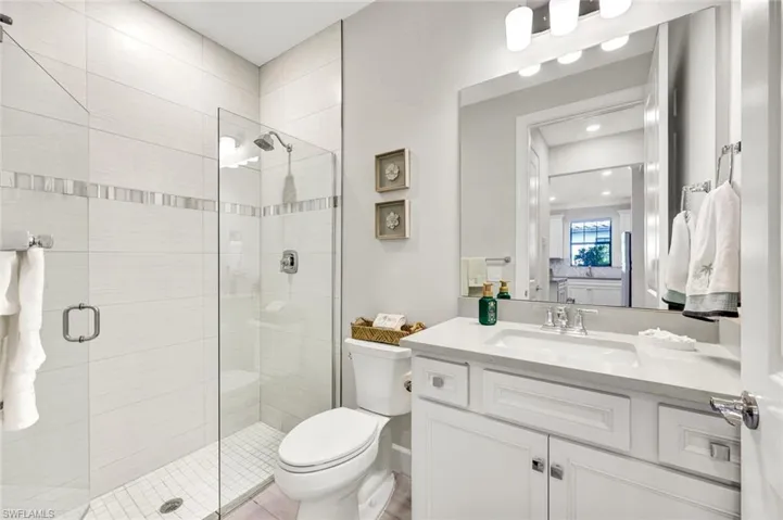 Bathroom with vanity and a stall shower
