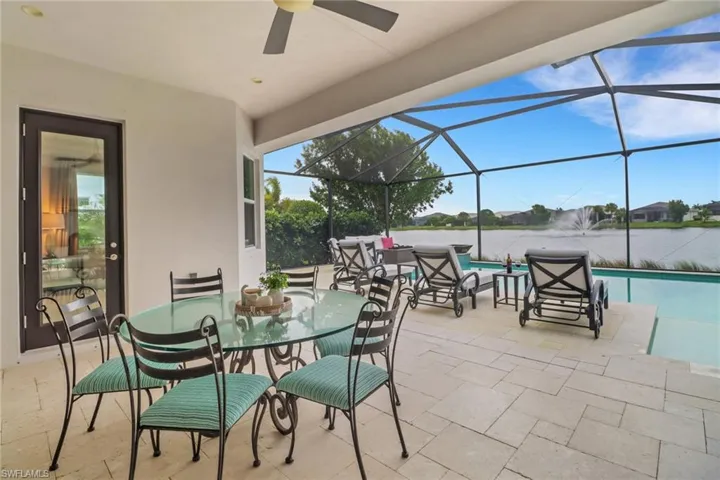 The covered lanai offers spaces for outdoor living, dining and an outdoor kitchen