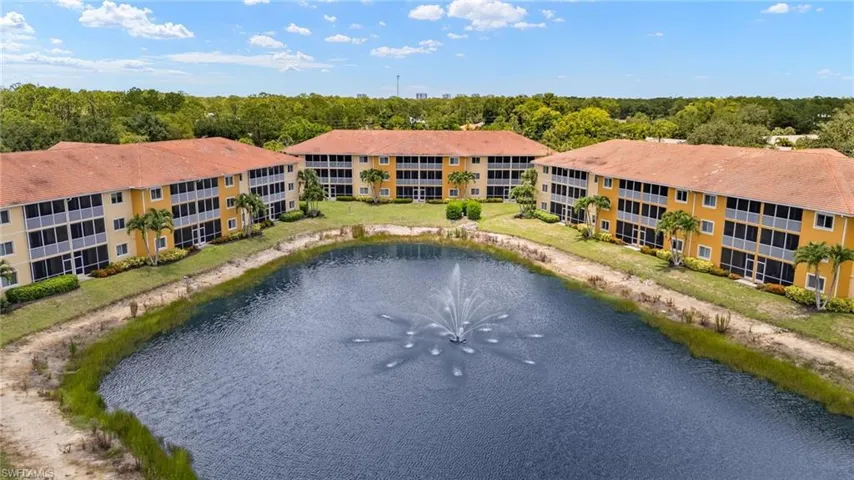 Bird's eye view of a nearby body of water and apartment complex