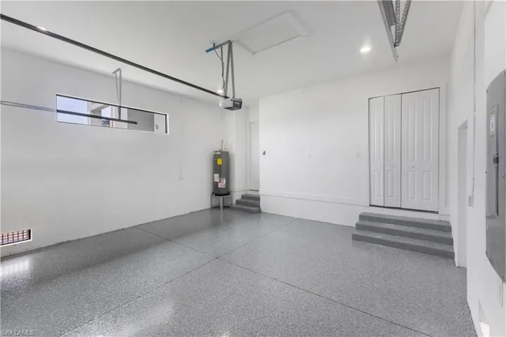 Garage with electric panel and electric water heater