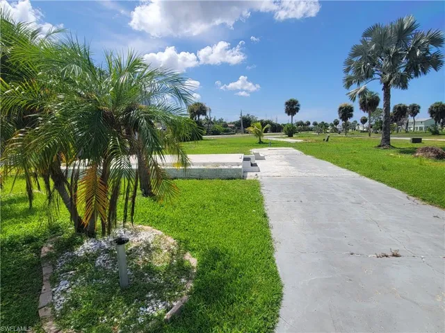 View of property's community with a yard