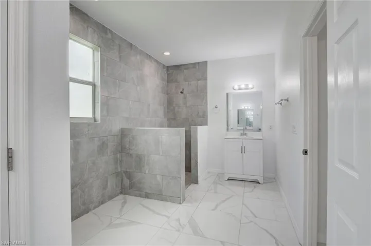 Bathroom with tile flooring and vanity