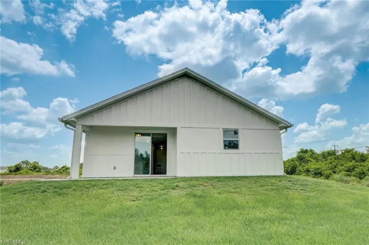 Rear view of property and back yard