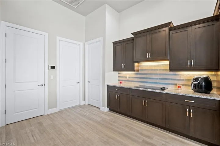 Plenty of room for multiple cooks, Large pantry and Laundry rooms allow for hidden storage within the kitchen area.  Garage door enters into this area making it easy to bring in groceries and store them easily.