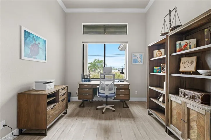 Natural light flows into the Den.  Glass pocket doors makes it great for an office or keep it open for additional sitting space.