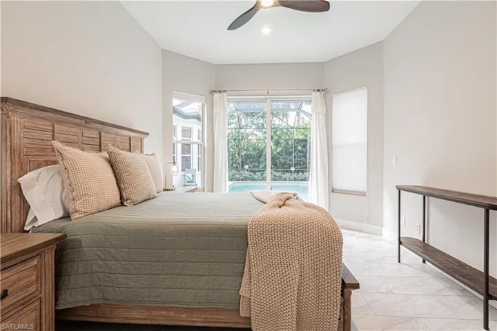 Bedroom featuring access to exterior and ceiling fan