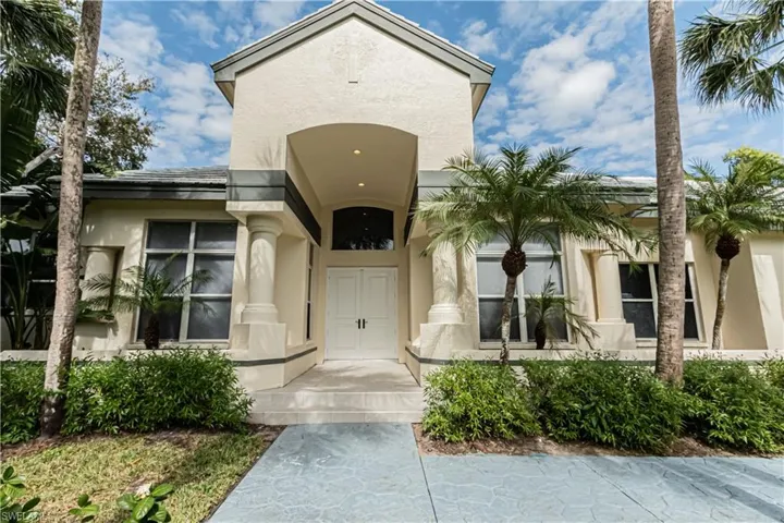 View of exterior entry featuring stucco siding