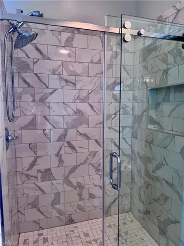 Bathroom featuring an enclosed shower