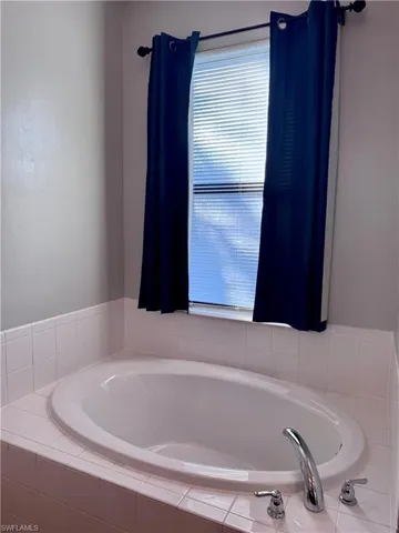 Bathroom featuring tiled bath
