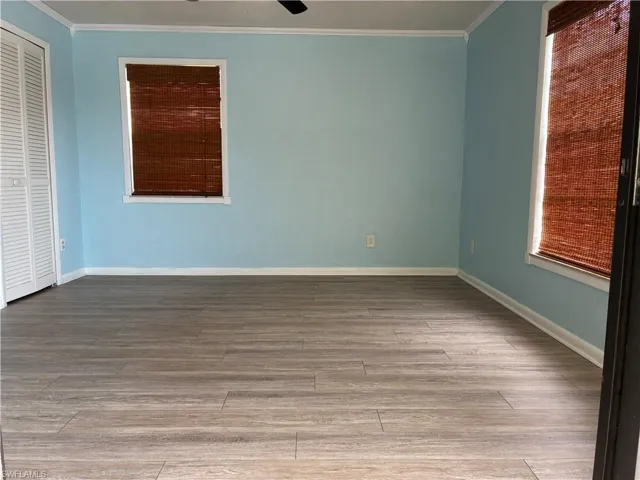 Large master bedroom with laminate flooring
