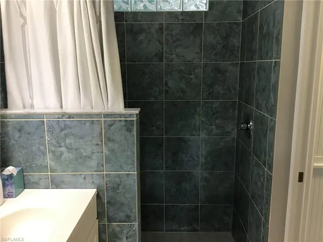 Full bathroom featuring vanity and a walk in shower