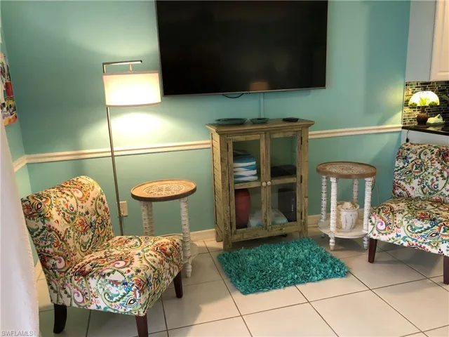 Sitting room featuring tile patterned floors
