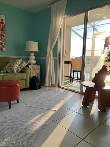 Living room to screened lanai and pool.