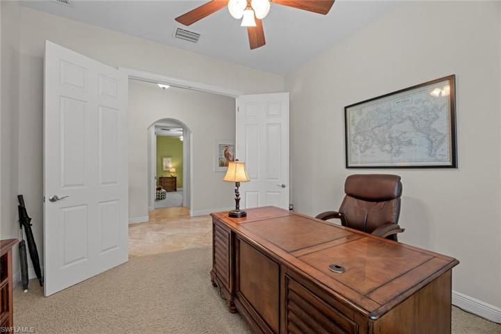 Den/office has French door for privacy