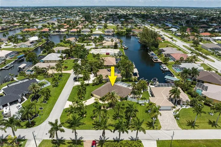Aerial overview of property's location with nearby suburban area and a large body of water