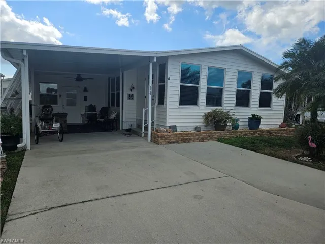 Manufactured / mobile home with ceiling fan and a carport