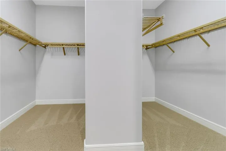 His/Her walk-in closet for primary bedroom