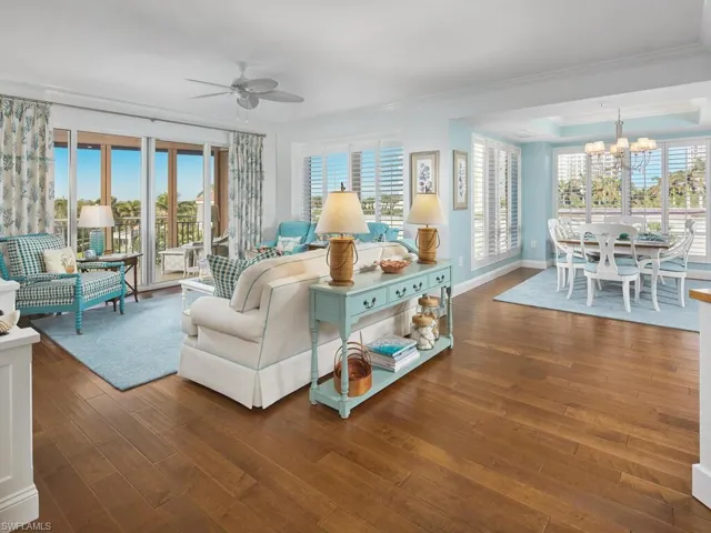 The large great room offers floor to ceiling windows with so much gathering space for friends and family.