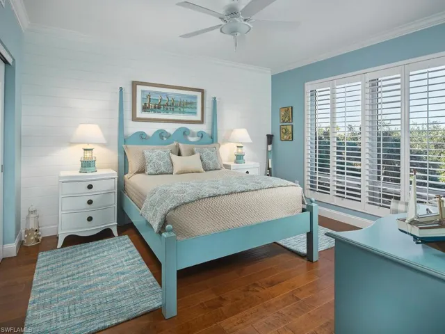 Second guest bedroom offers wood flooring and a private en-suite bathroom.