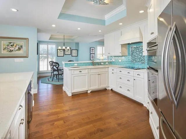 Kitchen features stainless appliances, quartz countertops, shaker cabinets, a large island and SO much more!