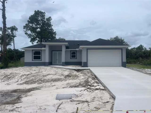 View of front of home featuring a garage