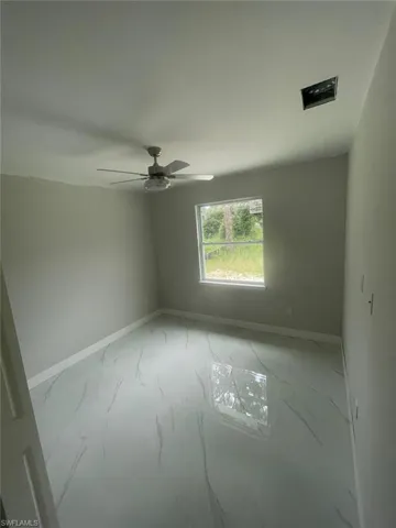 Spare room featuring ceiling fan