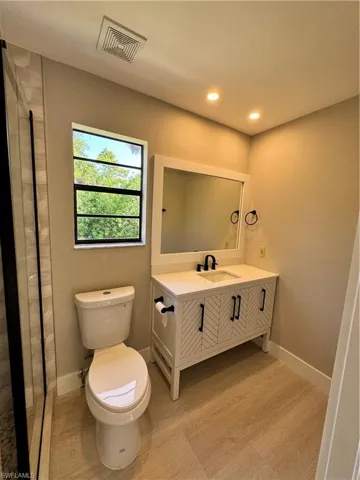 Bathroom with vanity and toilet