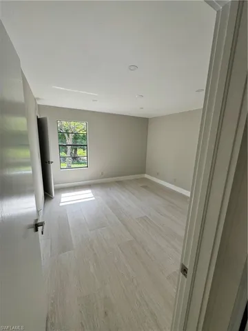 Empty room featuring light wood-type flooring
