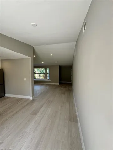 Spare room with light wood-type flooring