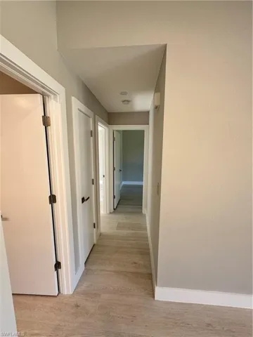 Hallway featuring light wood-type flooring