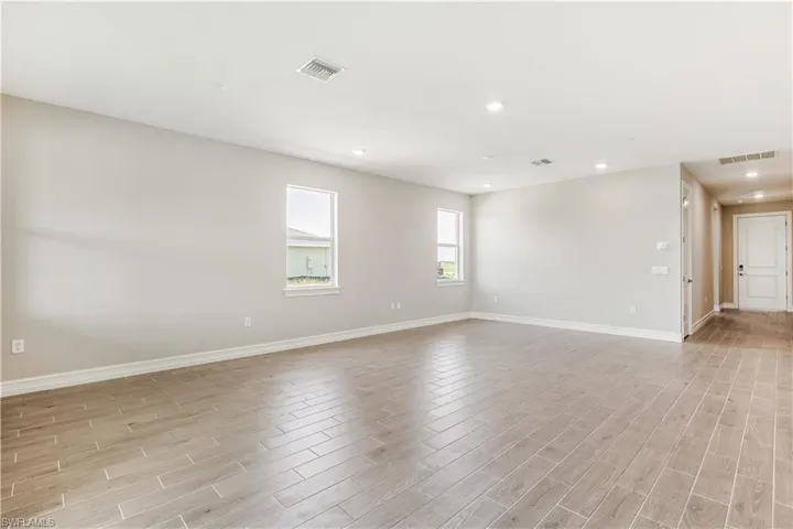 Spare room with recessed lighting and light wood finished floors