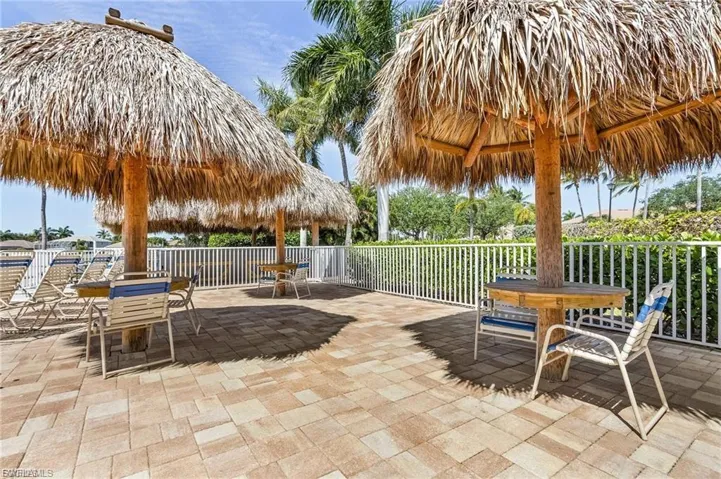 View of patio featuring outdoor dining space and a gazebo