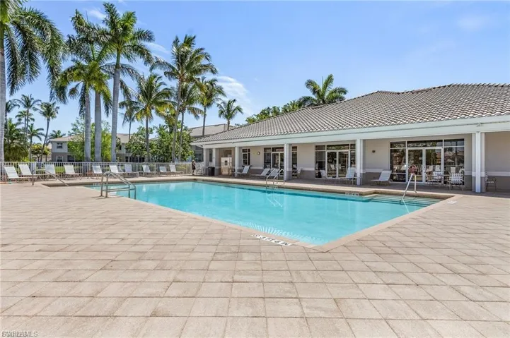 Community pool with a patio area