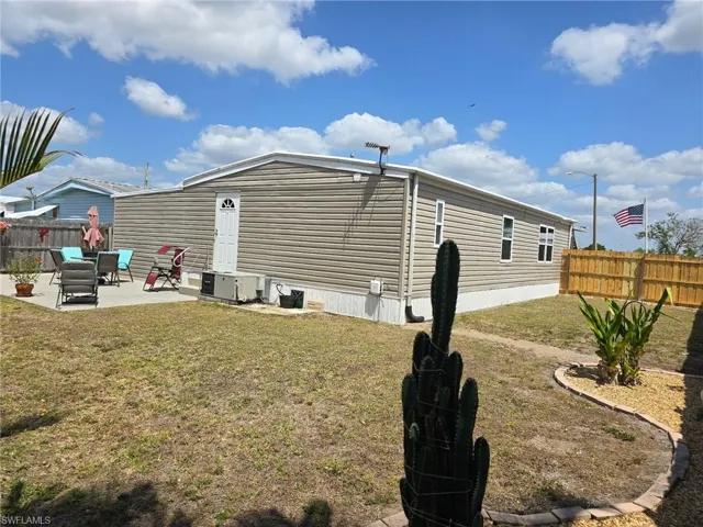 View of side of home featuring a patio area
