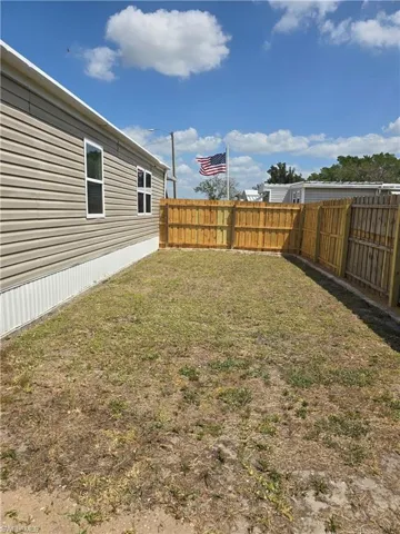 View of fenced backyard