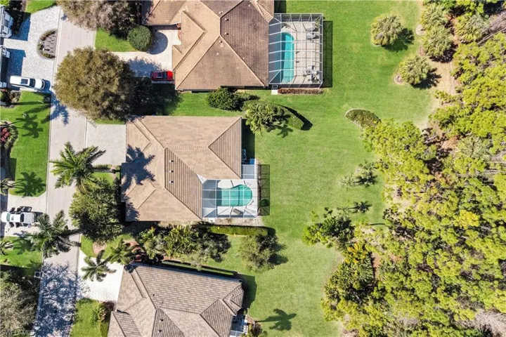 View of subject property with a pool