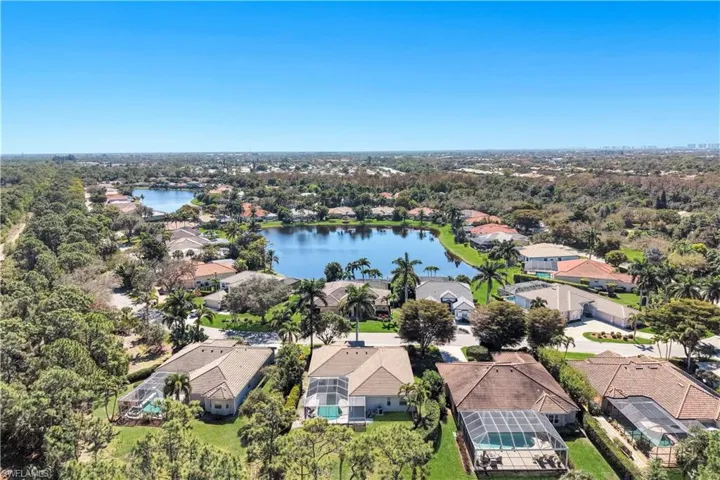 Aerial view of residential area featuring a large body of water
