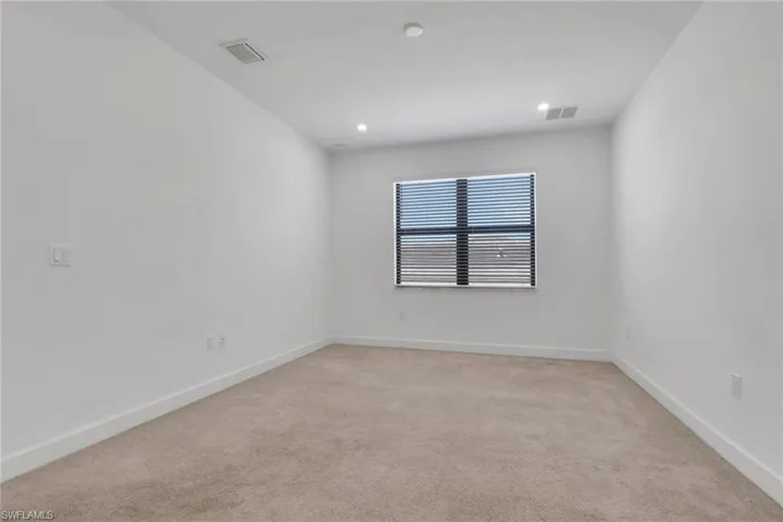 2nd bedroom is ensuite with walk-in closet and private bath.