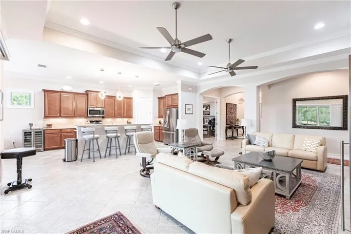 Living room with an open feel adjacent to large kitchen.
