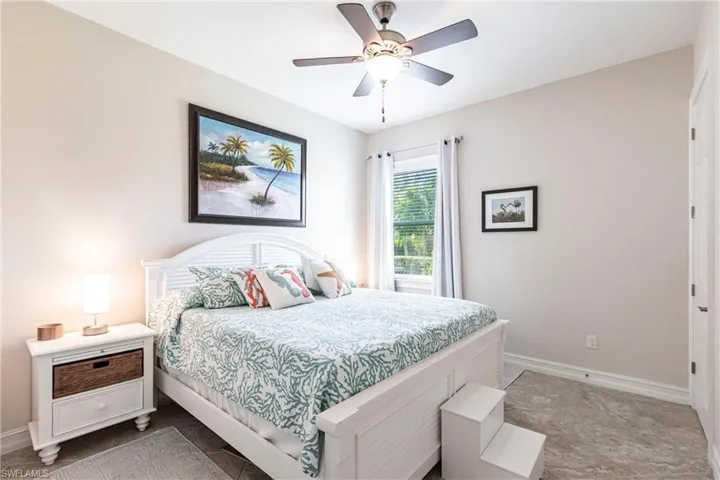 Large Bedroom featuring ceiling fan and spacious closet.