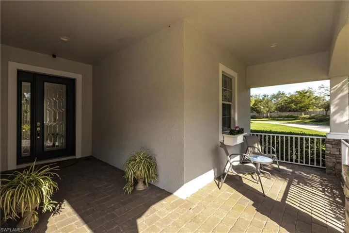Property entrance with covered porch