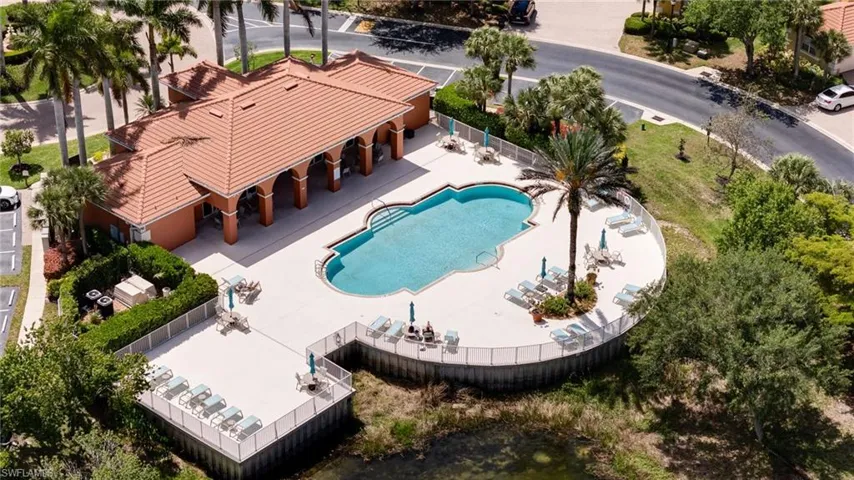 Community pool featuring a patio