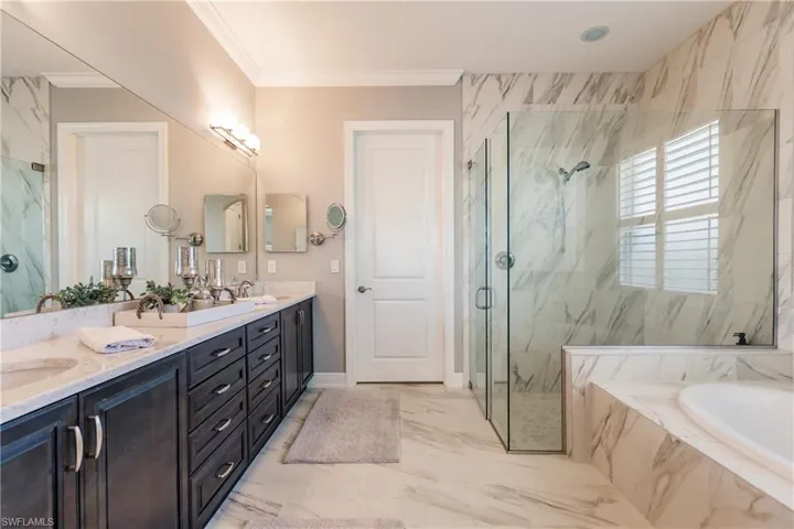 THE MASTER BATHROOM IS SIMPLY AMAZING WITH GLASSED-IN SHOWER WITH TILE TO THE TOP & BEAUTIFUL SOAKING TUB!