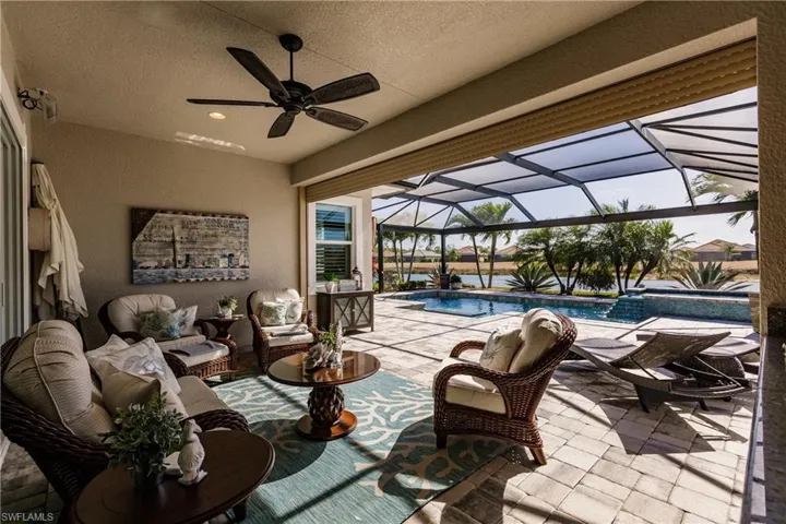 HUGE ENTERTAINMENT AREA UNDERNEATH THE LANAI. NOTE THE ELECTRIC STORM PANEL. LOWER THE PANEL & THIS ENTIRE AREA BECOMES COOL FAST WITH THE A.C. & THE UPGRADED FAN ON.